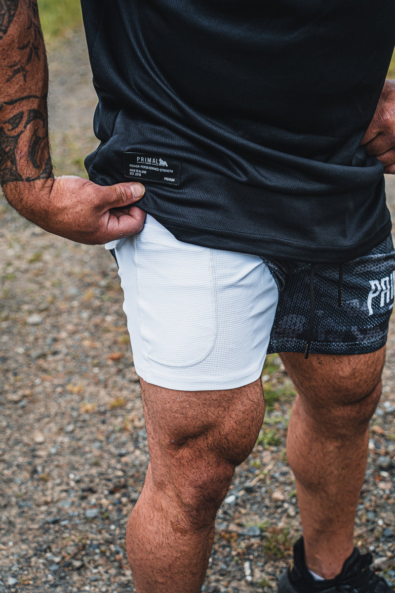 PRIMAL PERFORMANCE 2-IN-1 COMPRESSION SHORTS