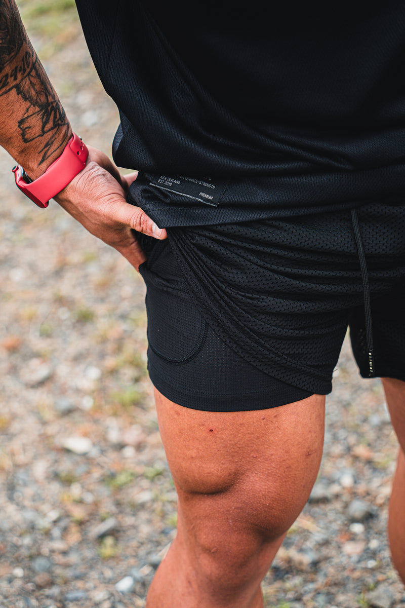 PRIMAL PERFORMANCE 2-IN-1 COMPRESSION SHORTS