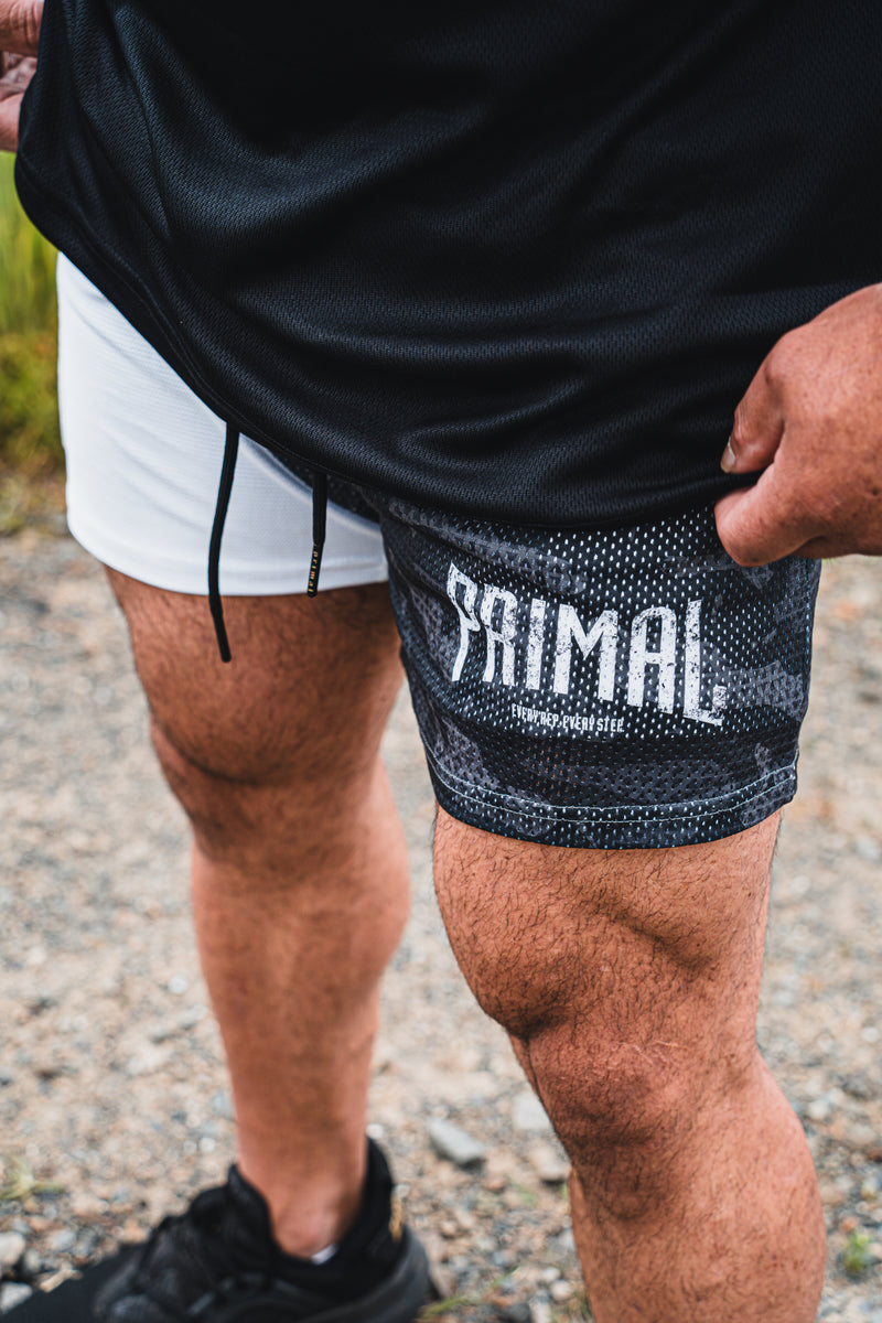 PRIMAL PERFORMANCE 2-IN-1 COMPRESSION SHORTS