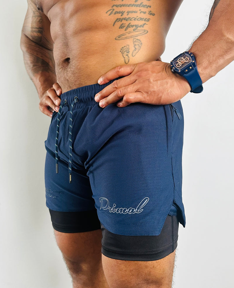 PRIMAL PERFORMANCE 2-IN-1 COMPRESSION SHORTS