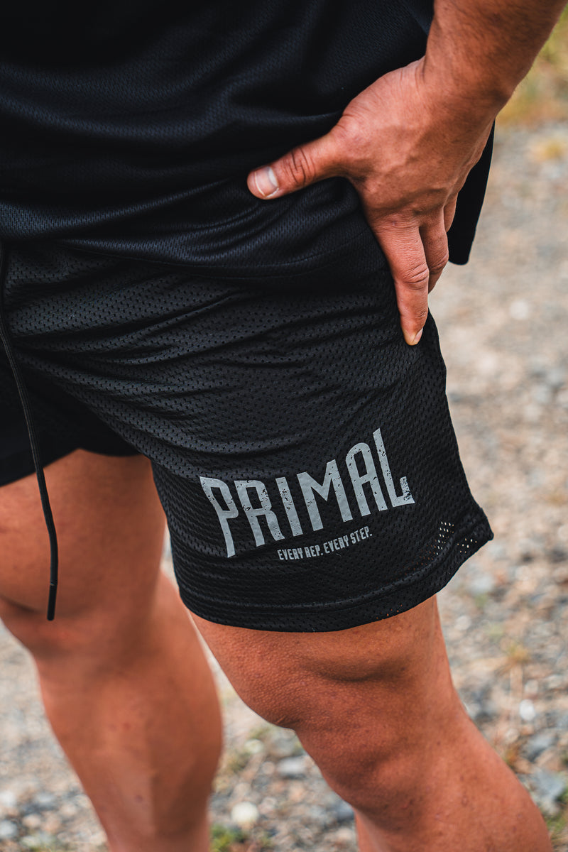 PRIMAL PERFORMANCE 2-IN-1 COMPRESSION SHORTS