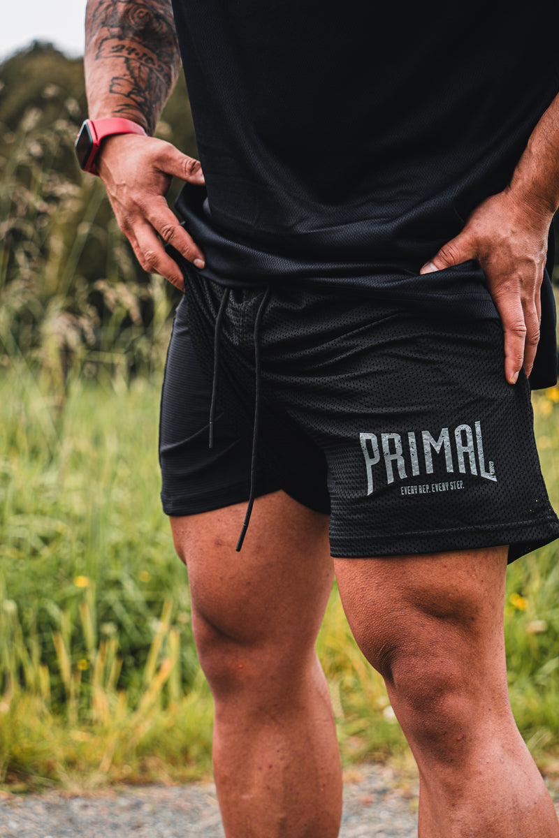 PRIMAL PERFORMANCE 2-IN-1 COMPRESSION SHORTS